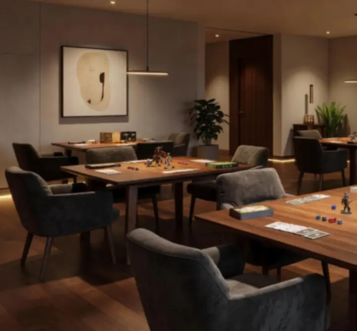 Espace indoor moderne avec lumières douces et tables de jeux prêtes pour un événement.